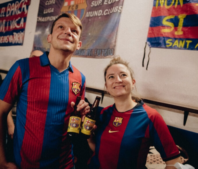 woman and man in barcelona football shirt