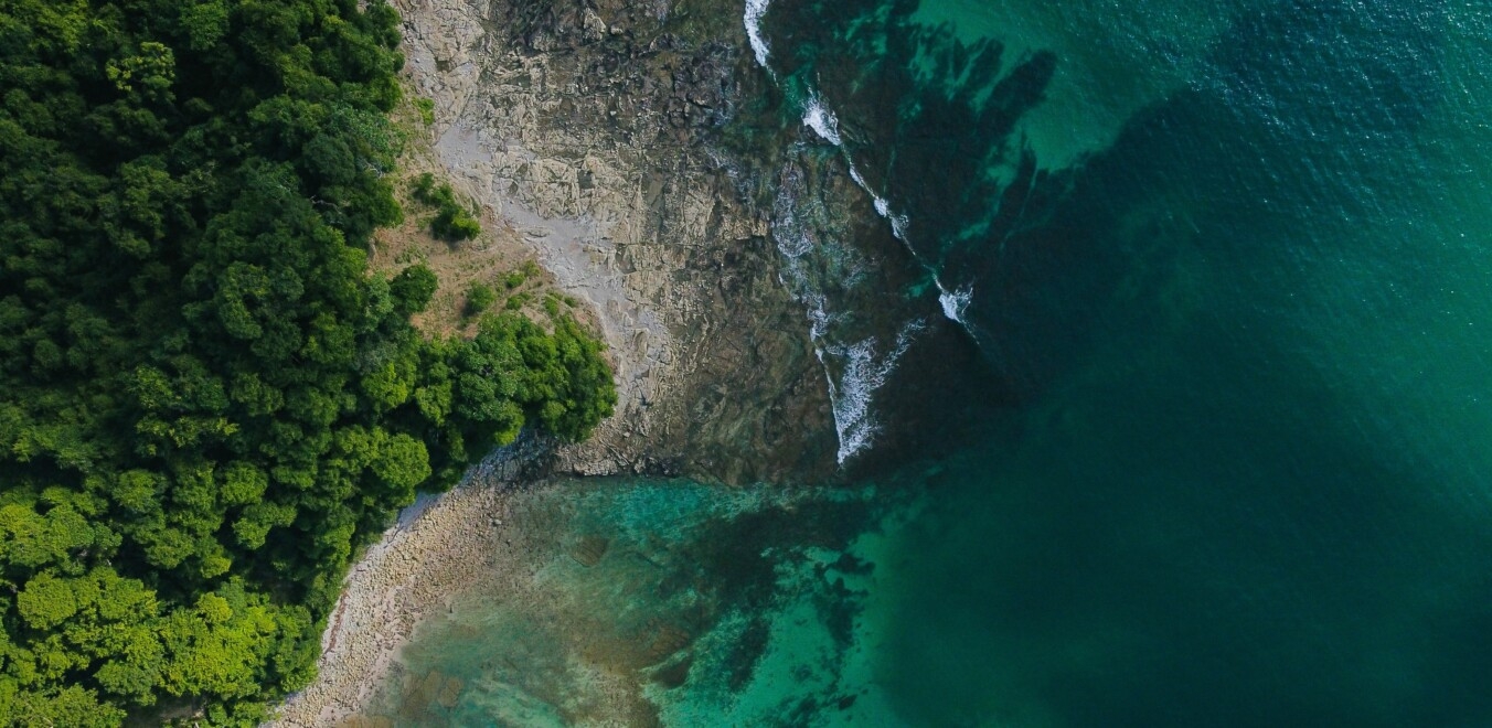 island scenery from arial view with clear waters near trees