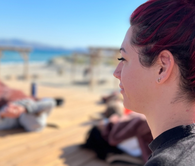 woman with pink hair at seaside