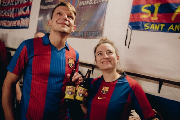 woman and man in barcelona football shirt