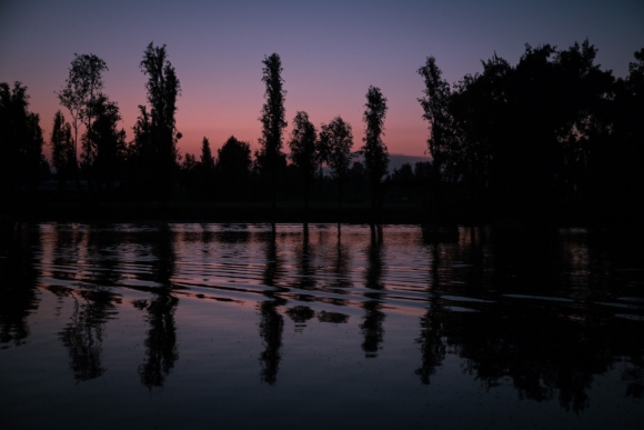 lake at dusk with pink and purple sky
