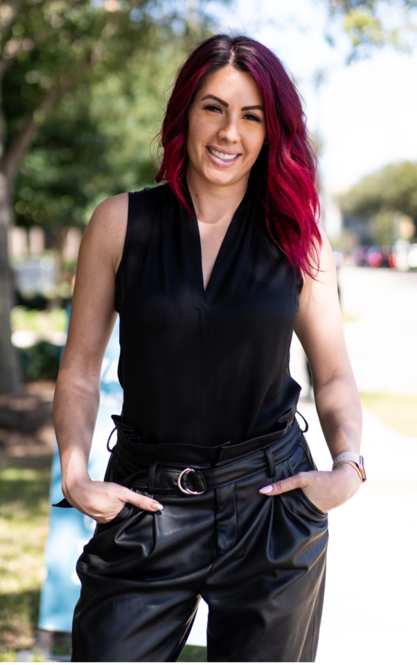 Women with red and black hair smiling