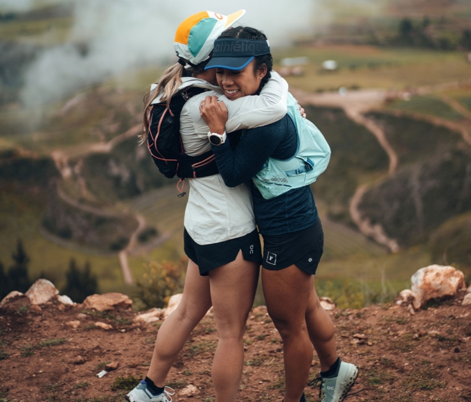 two female hikers hugging